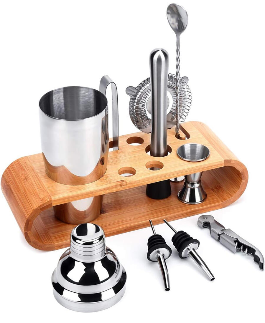 A picture of tools to make cocktails and a bamboo holder